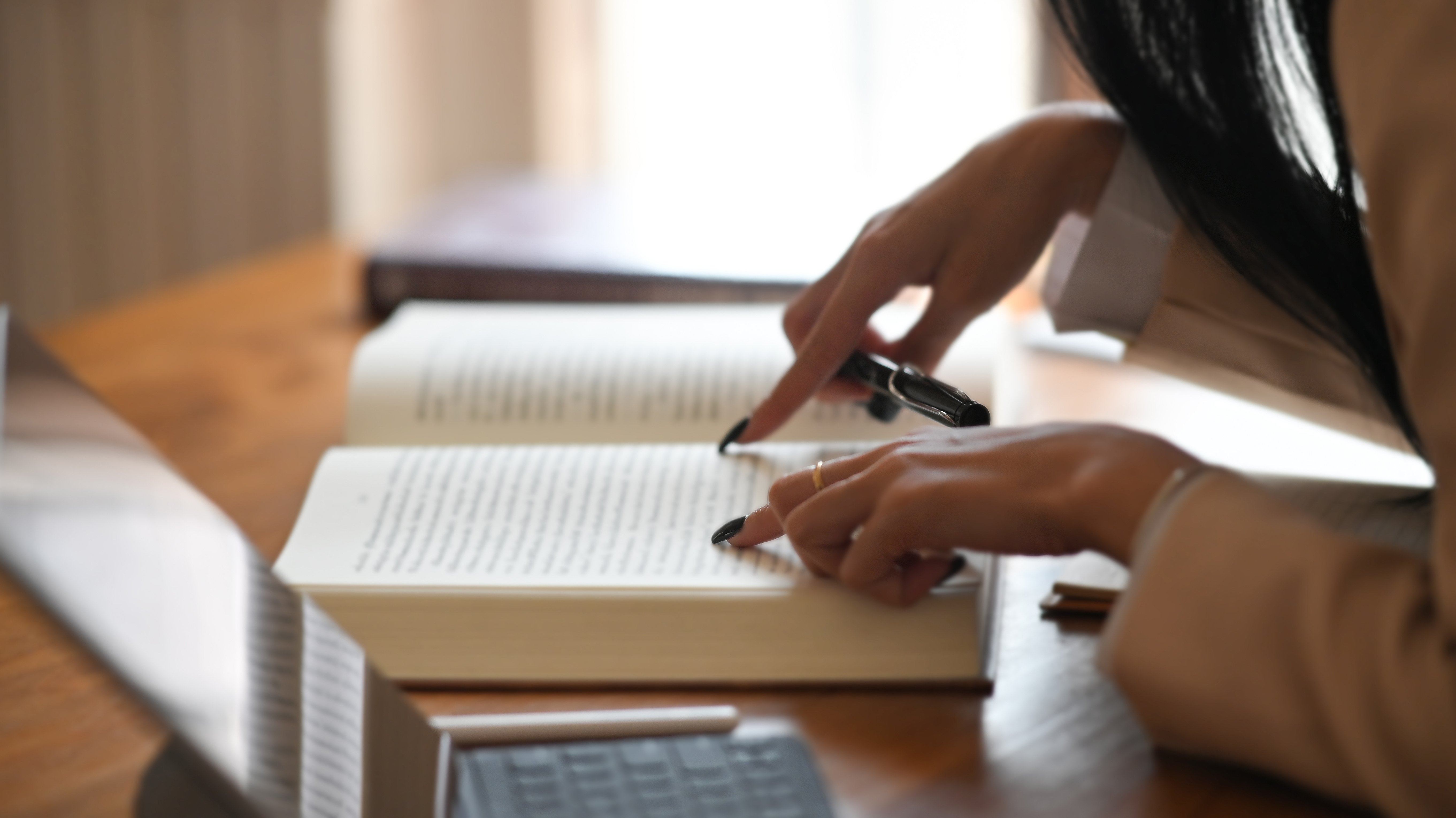 Close-up editor book with using tablet and stylus pen.